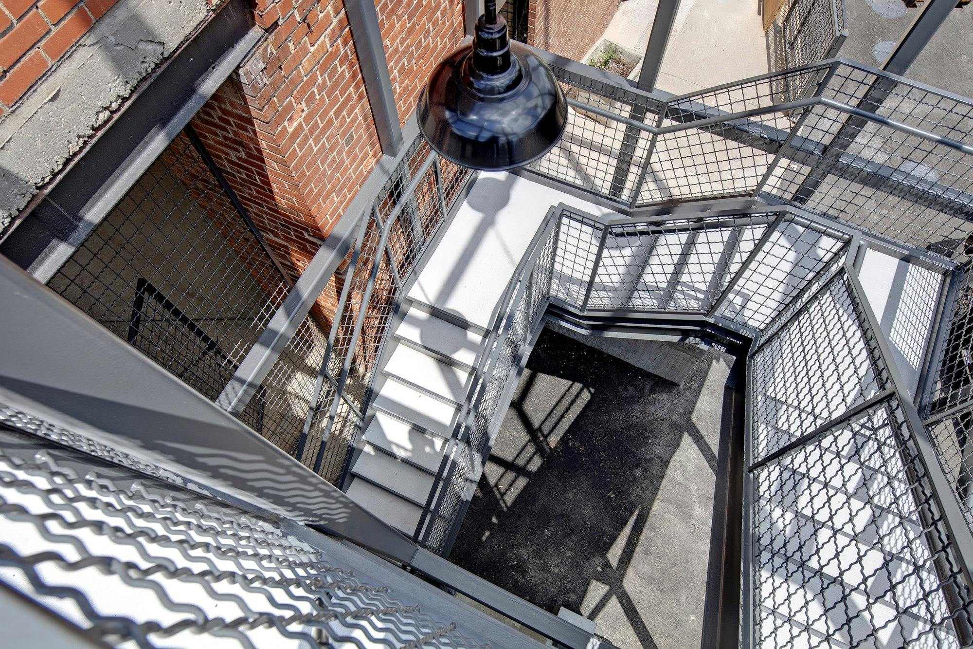 An aerial view of a stairway with metal railings.