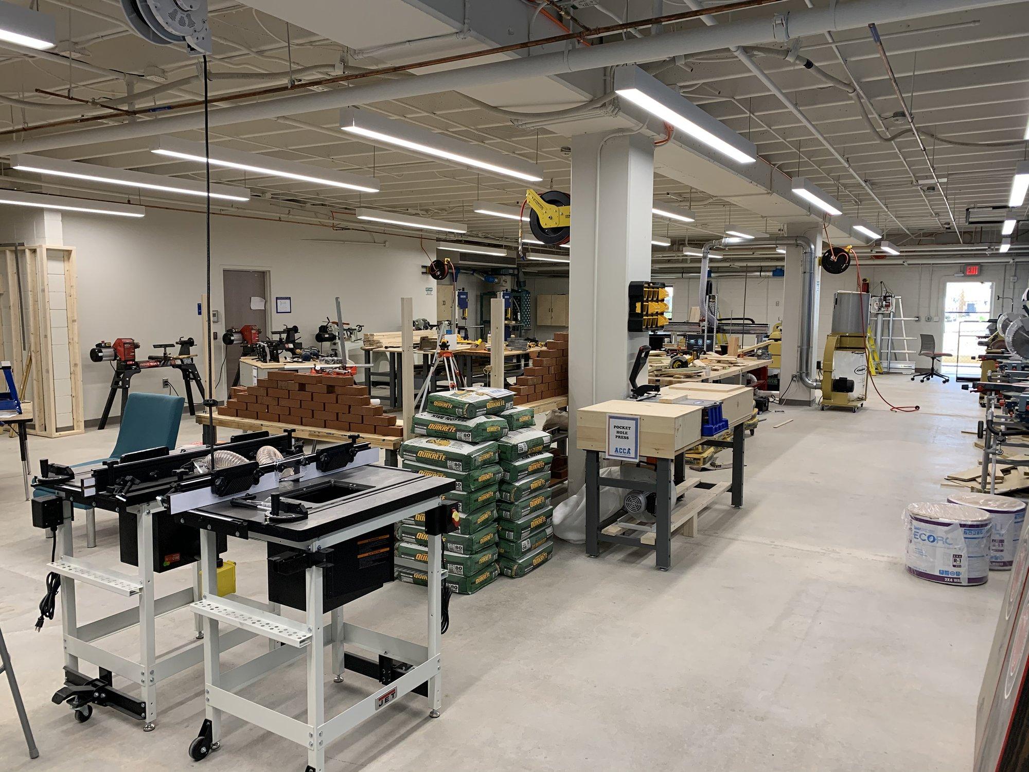 Large room with many tables of various construction equipment.