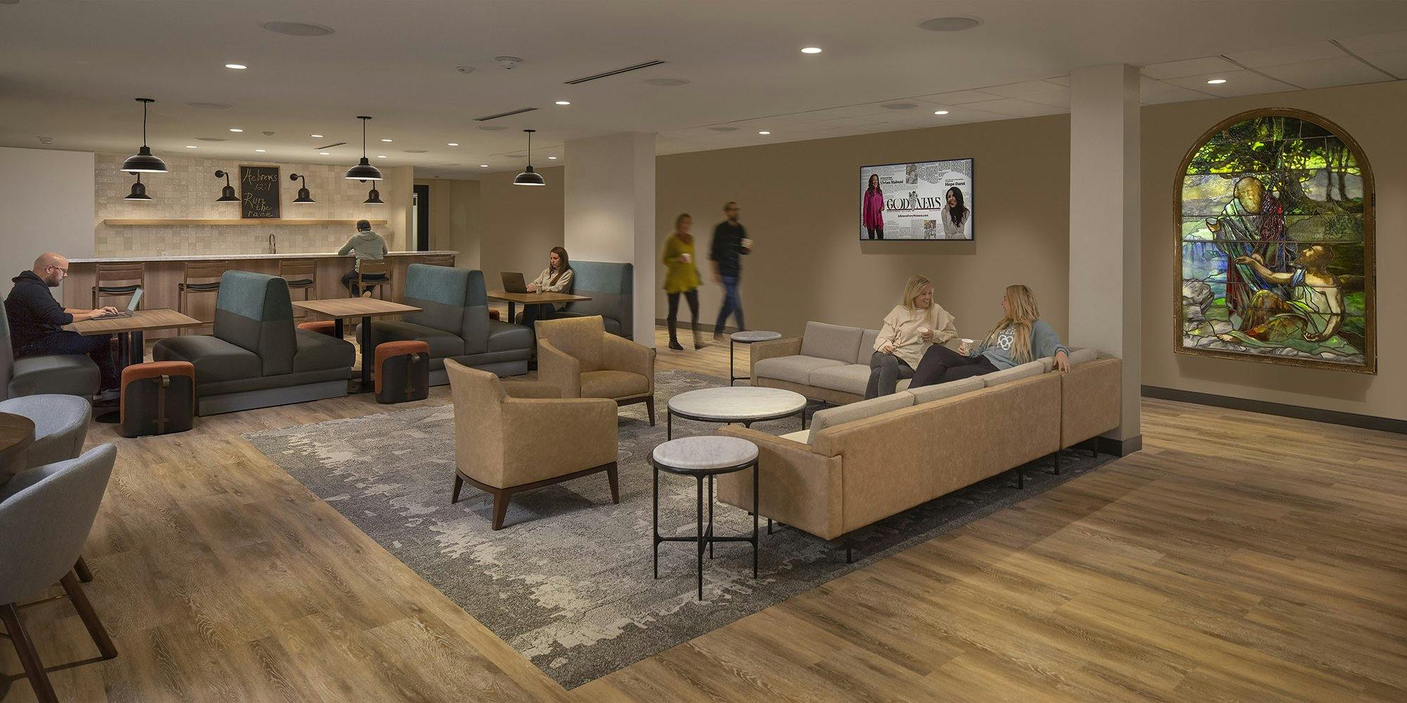 common area with several couches, booths, and chairs for visitors to relax, socialize, or work in