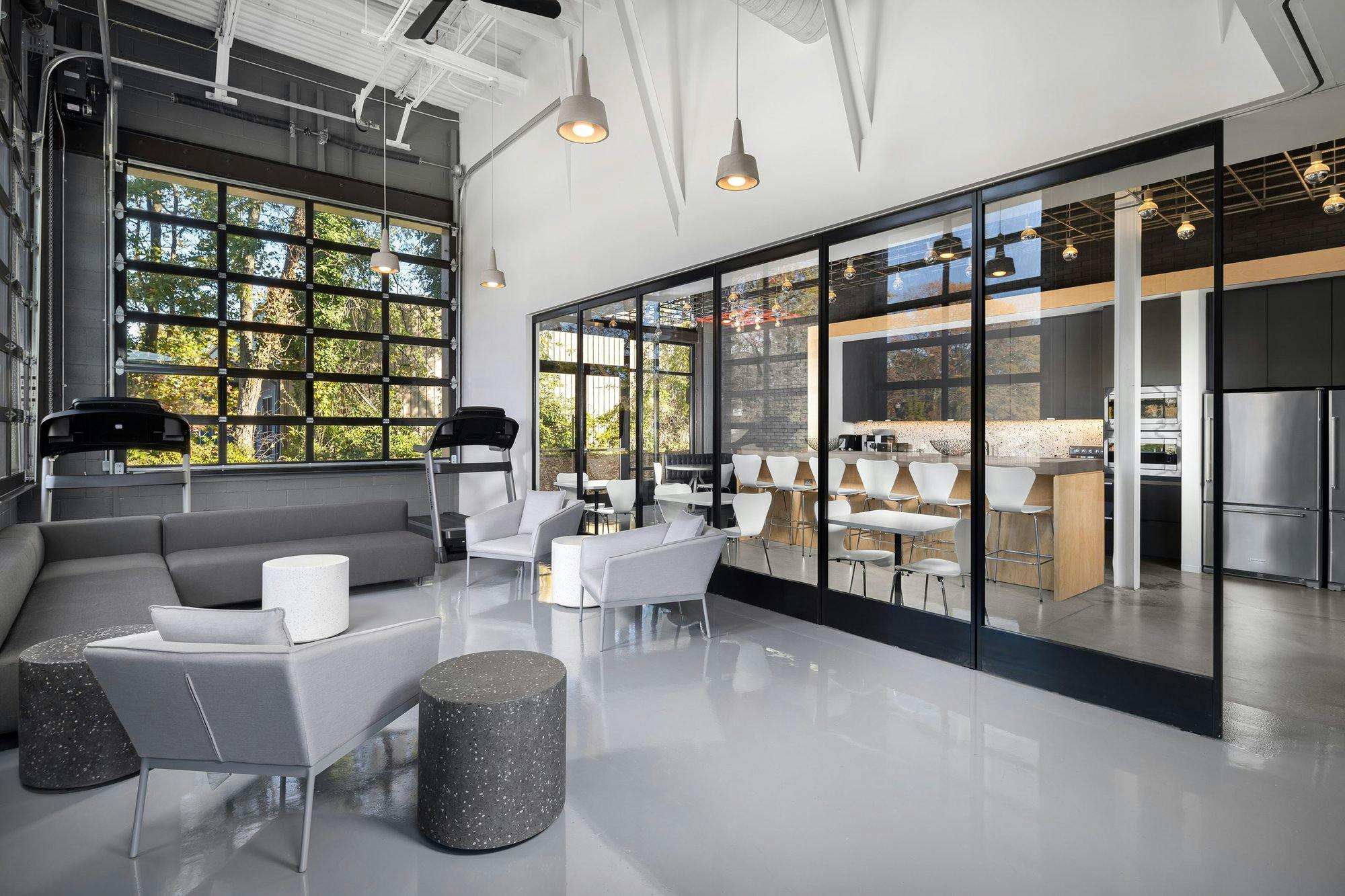 office space with seating area and treadmills.