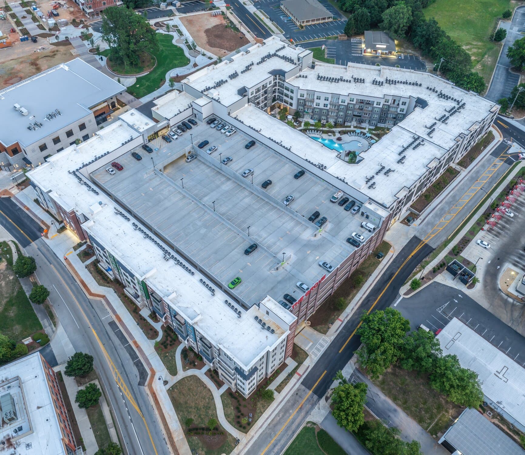 Aerial image of entire parking garage structure and surrounding buildings.