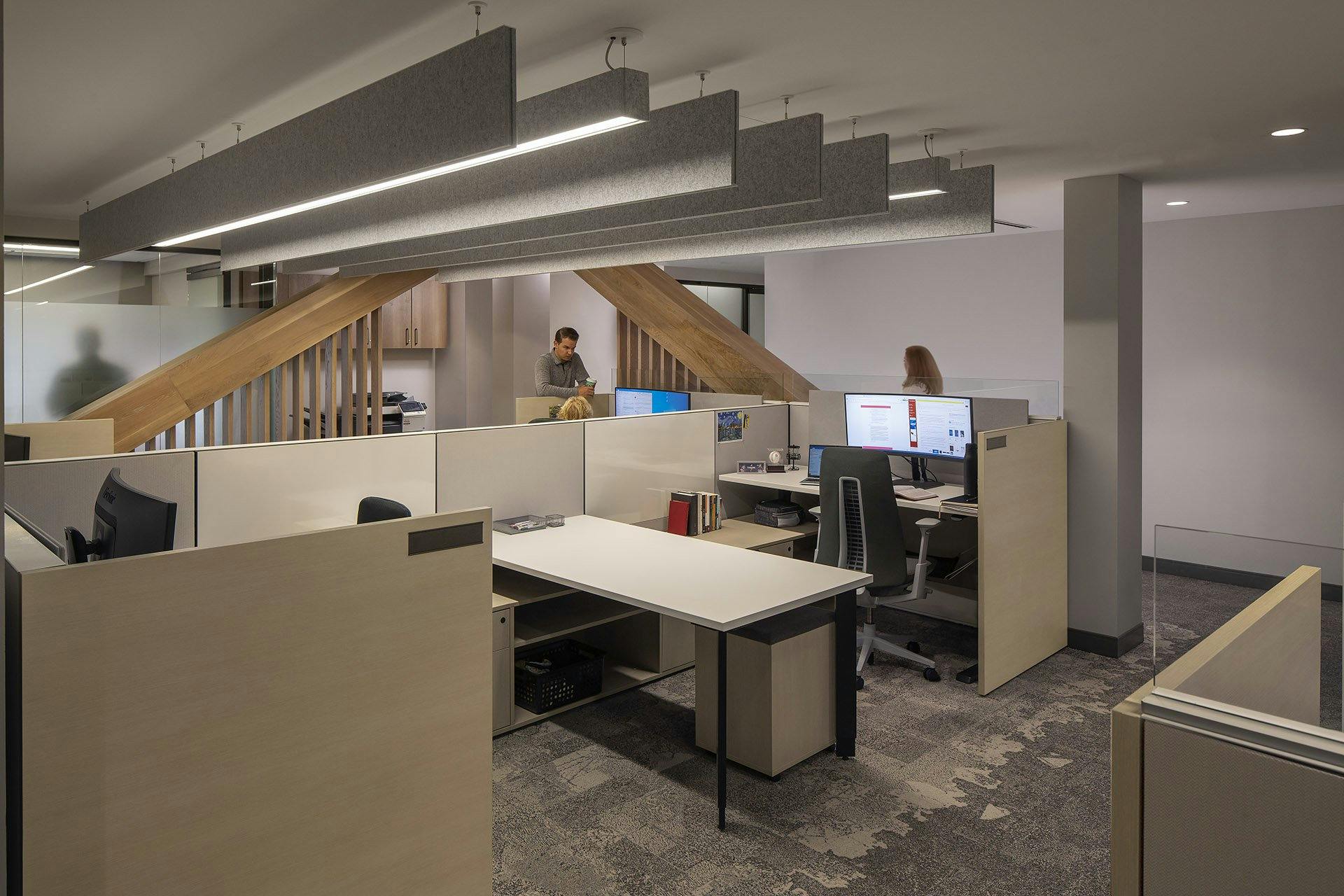 workspace with multiple cubicles and computers