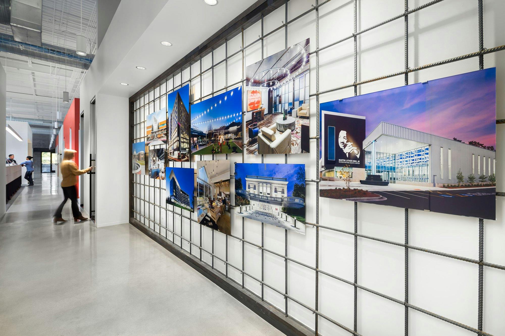 office space with pictures of construction projects on the wall.