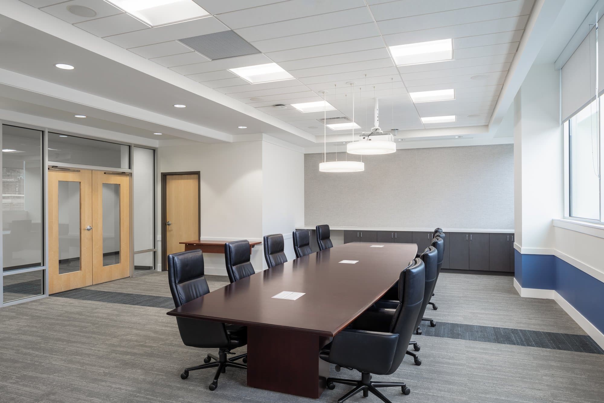 large conference room with a rectangular table in the center of the room