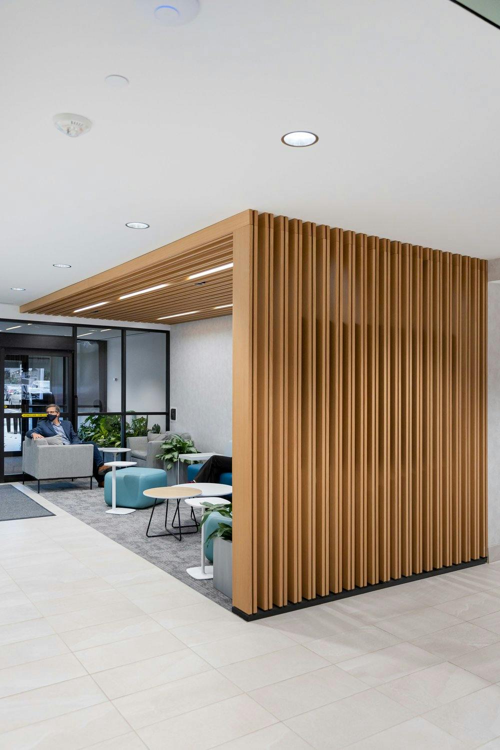 reception area with a wood partition to provide some privacy from the rest of the room