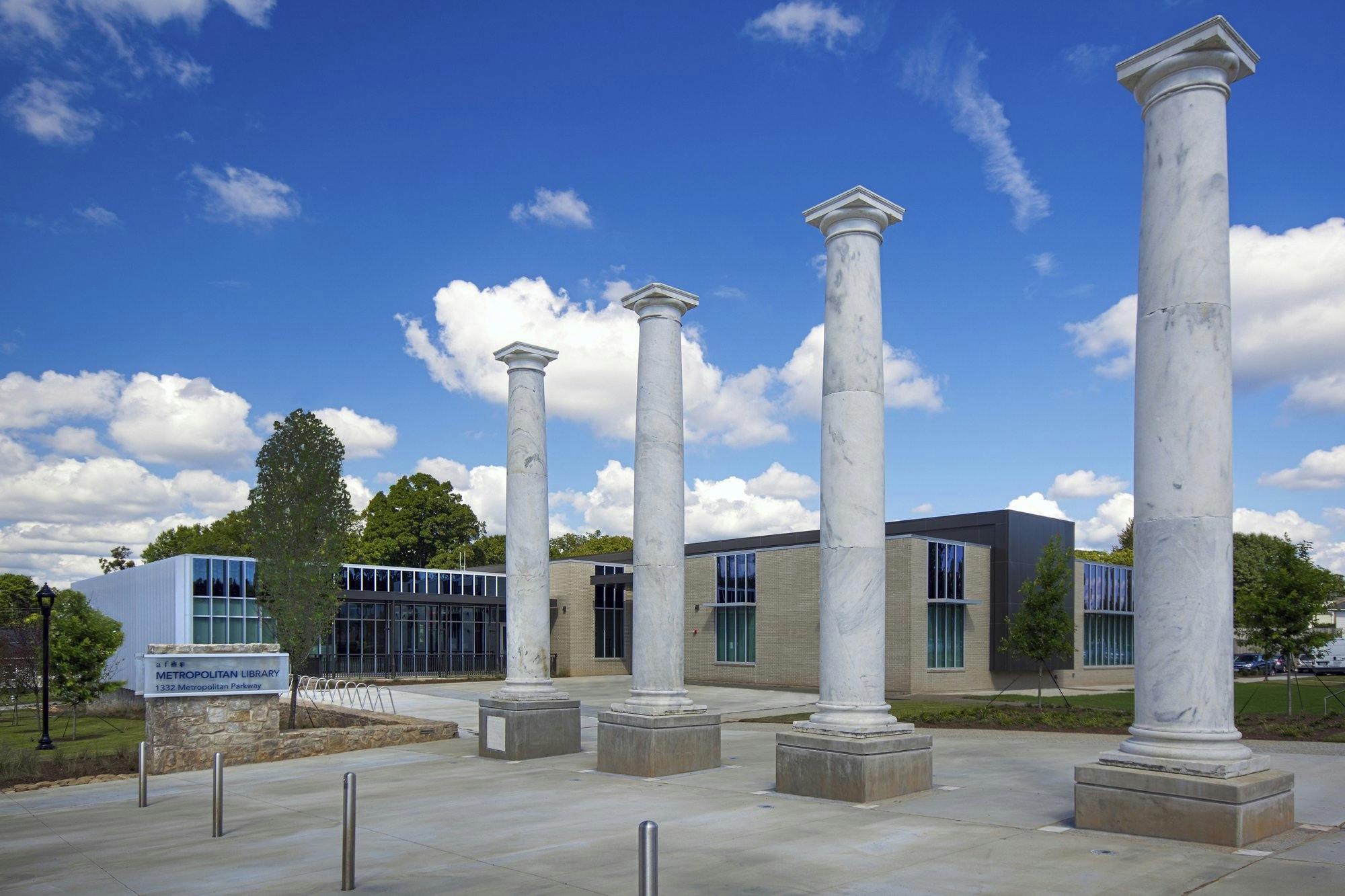 Four white granite, Doric columns from a church that was previously in the location.