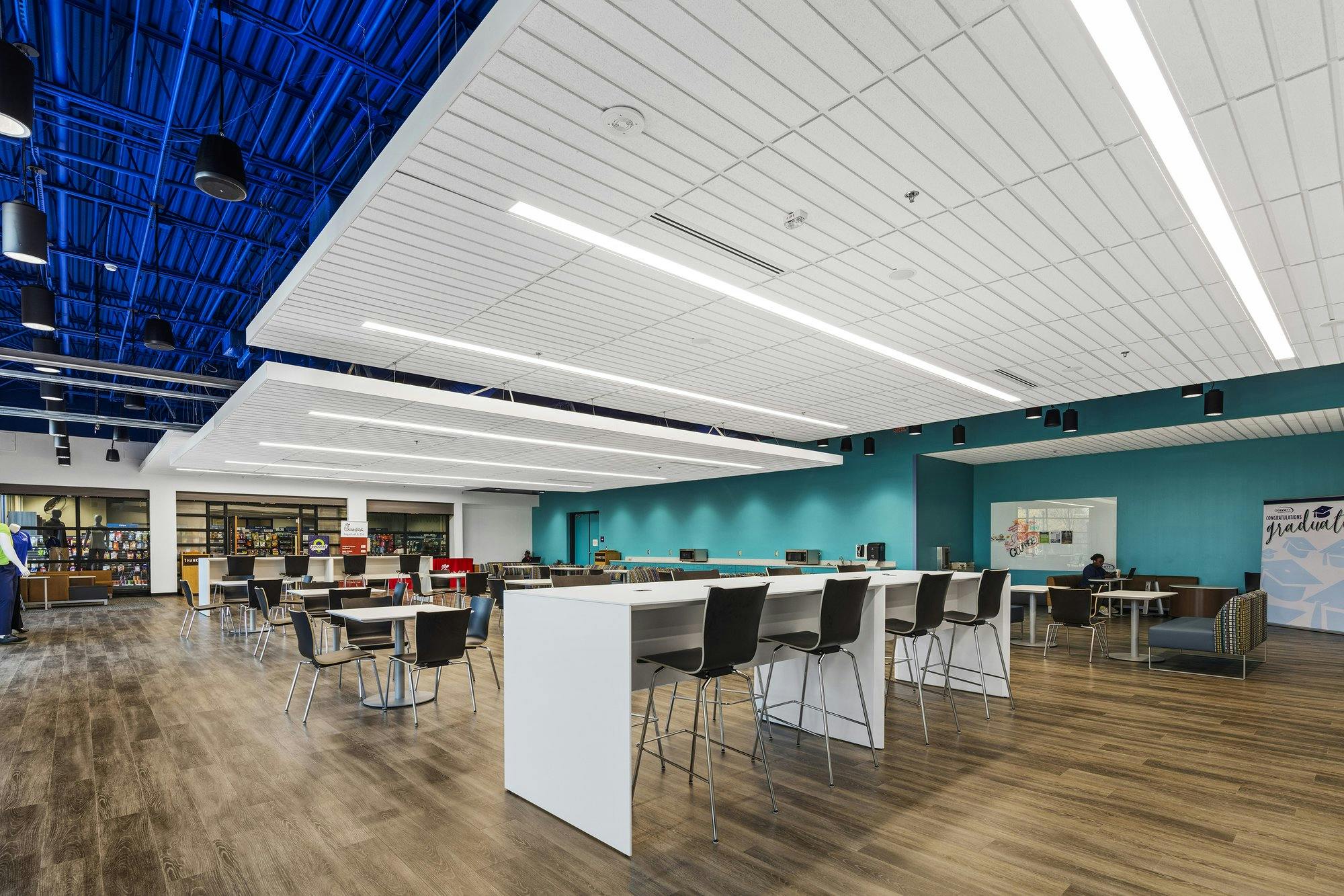 Dining hall area with tables and chairs.