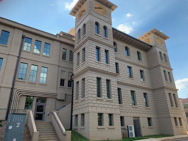 A large building with stairs leading up to it.