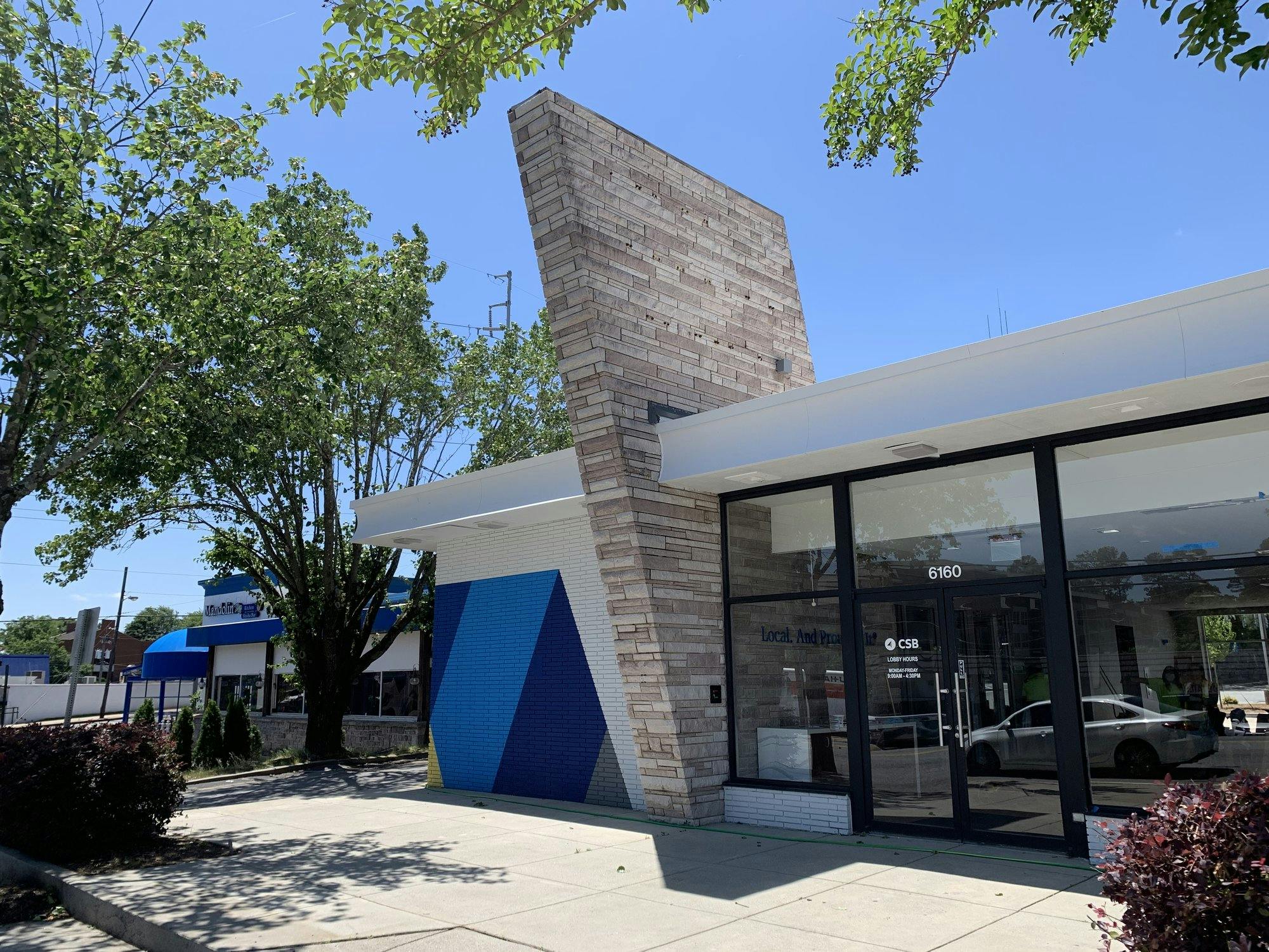 Front view of bank with glass entryway.