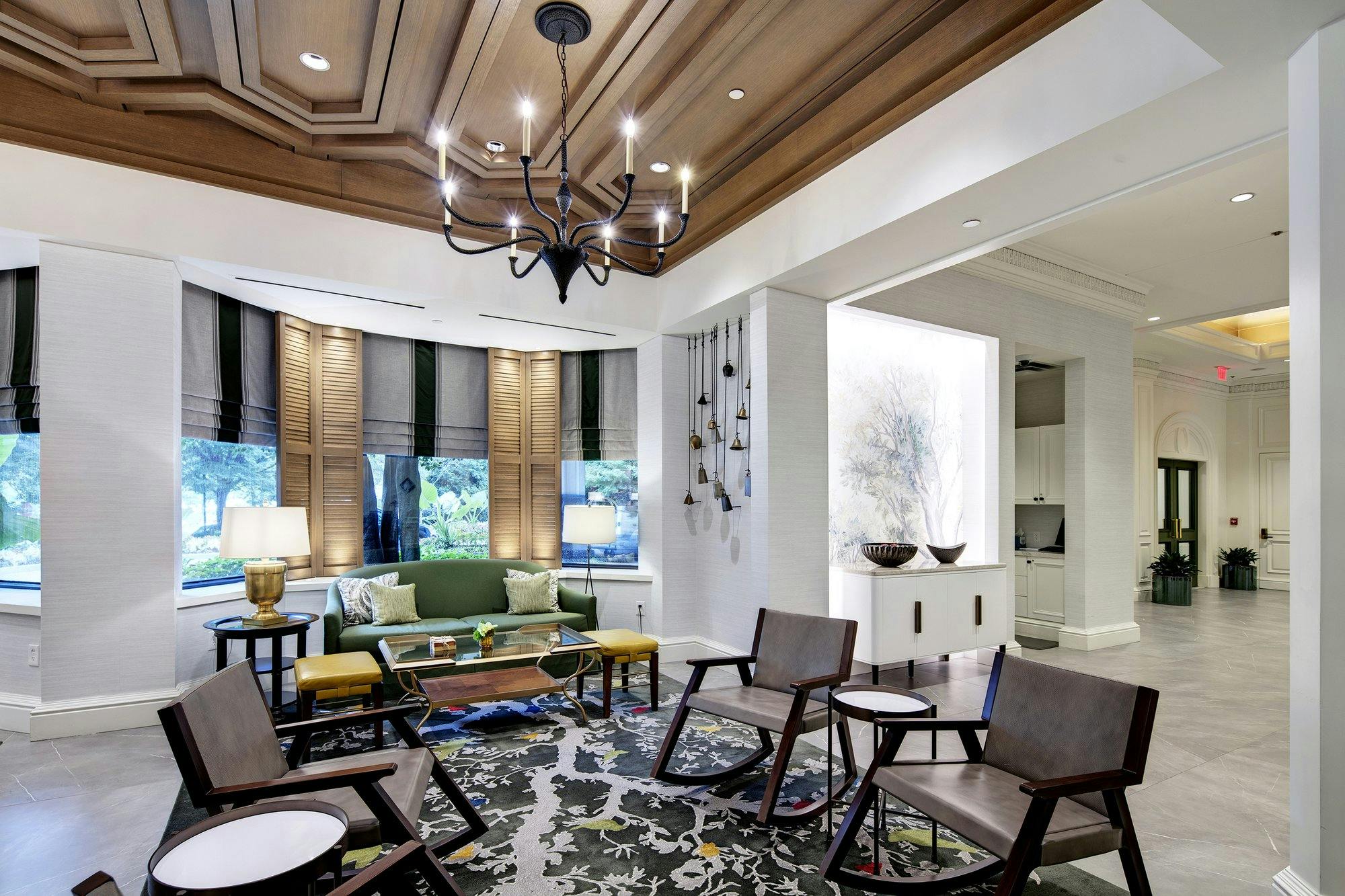 Hotel lobby seating area with chairs and sofa.