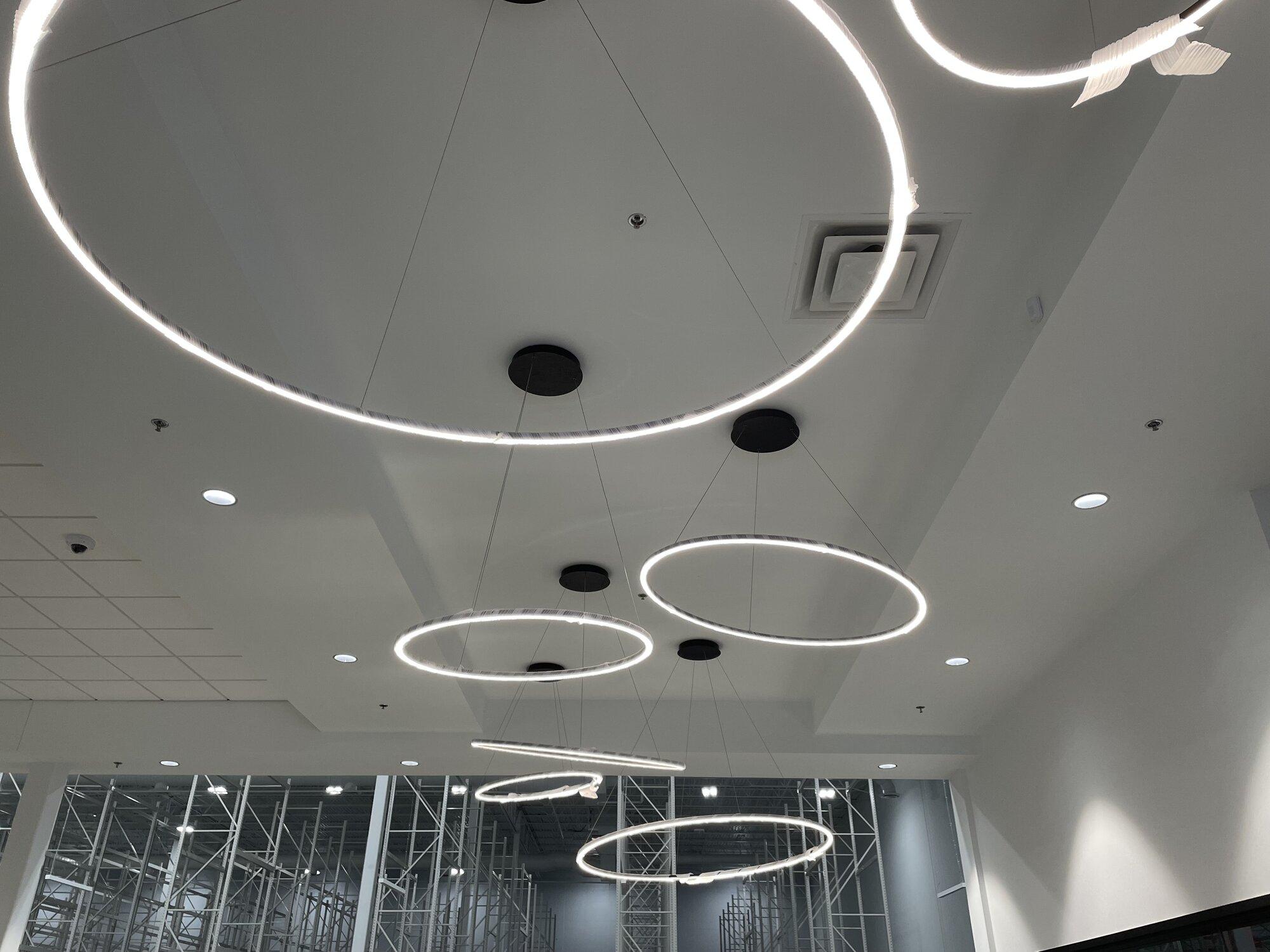 Interior ceiling image with circular ringed lighting.