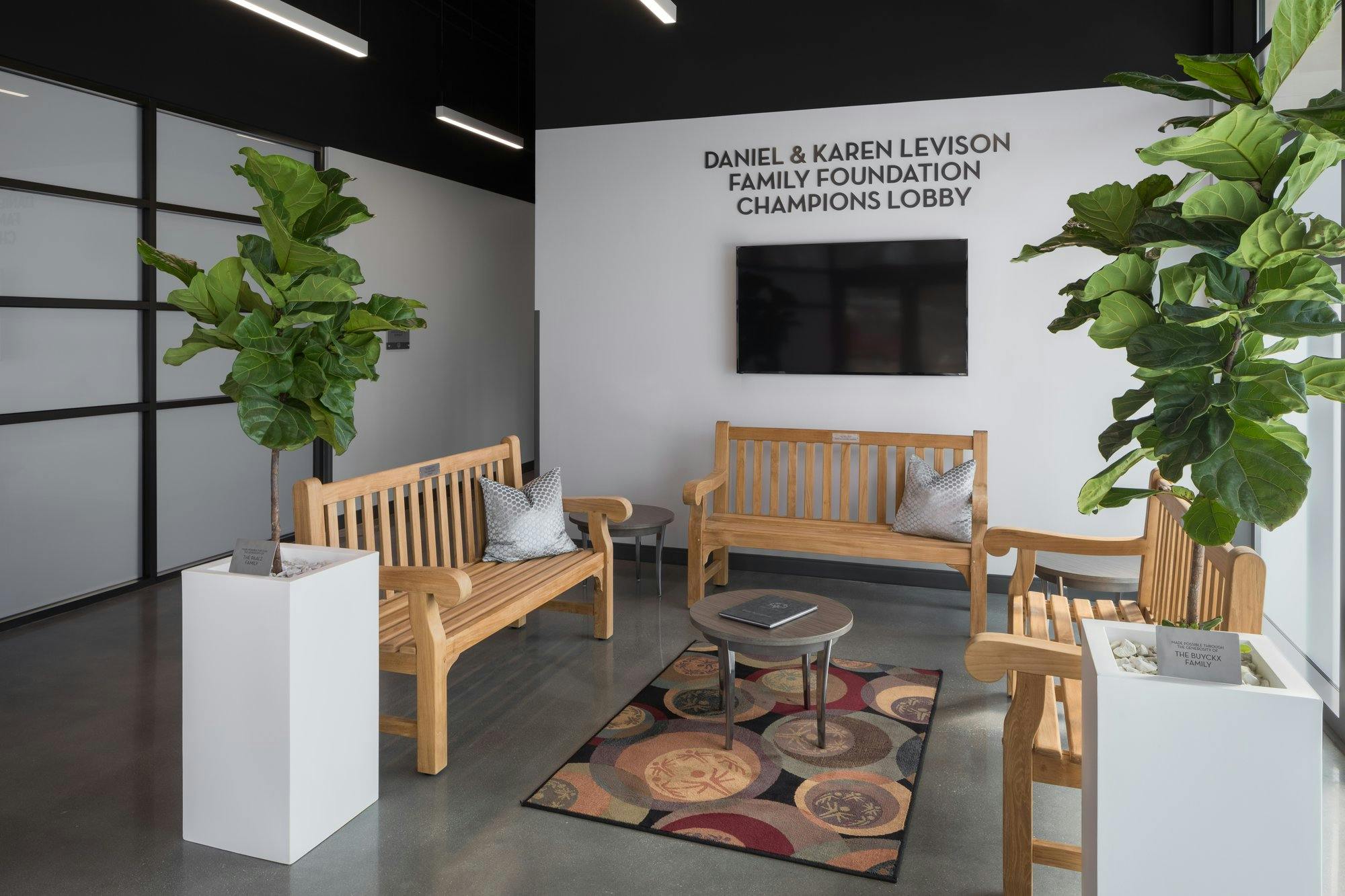 lobby area with several benches to rest on while waiting to begin a meeting