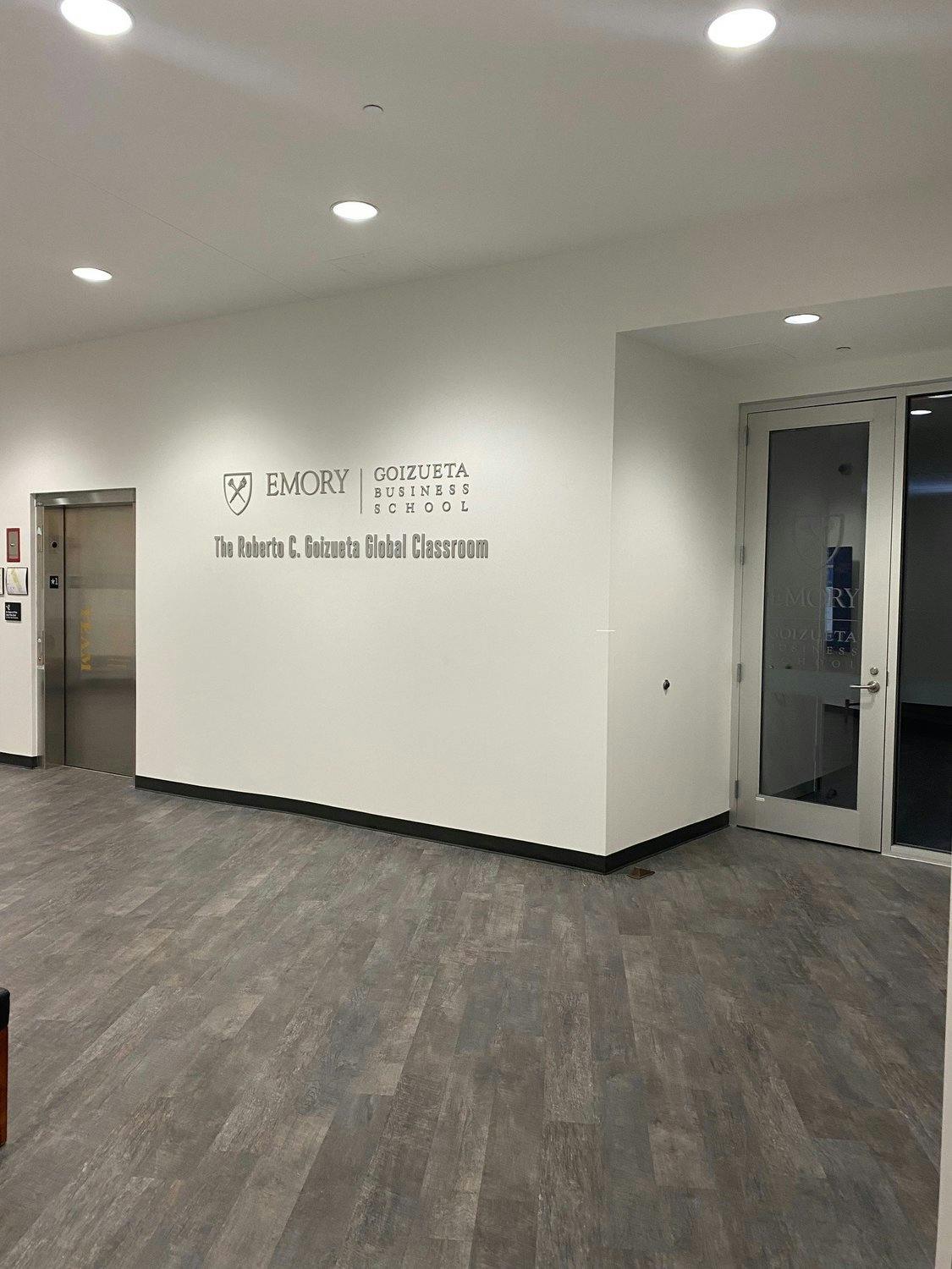 Emory University Goizueta Business School signage outside of classroom.