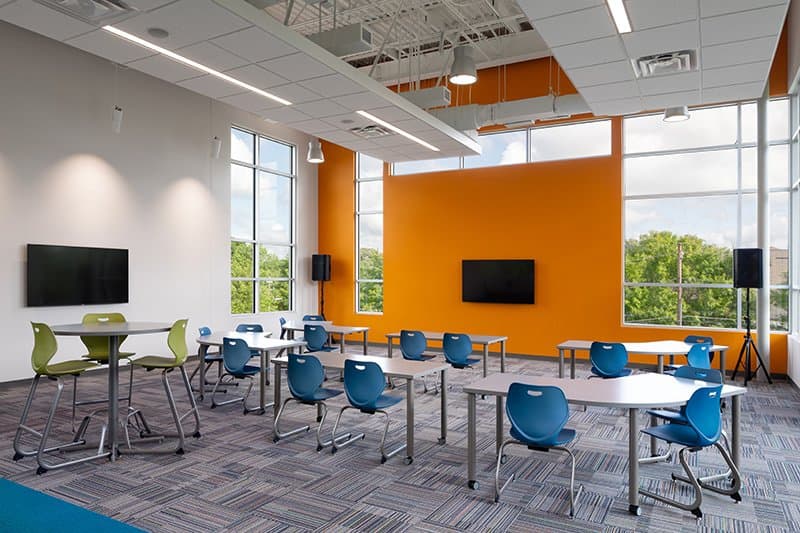 large classroom space with a variety of seating arrangements to allow for collaborative work