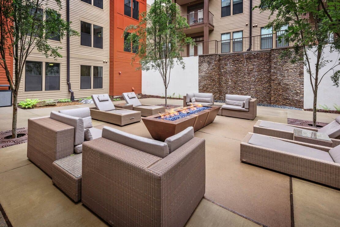 Resident outdoor courtyard with firepit and seating.