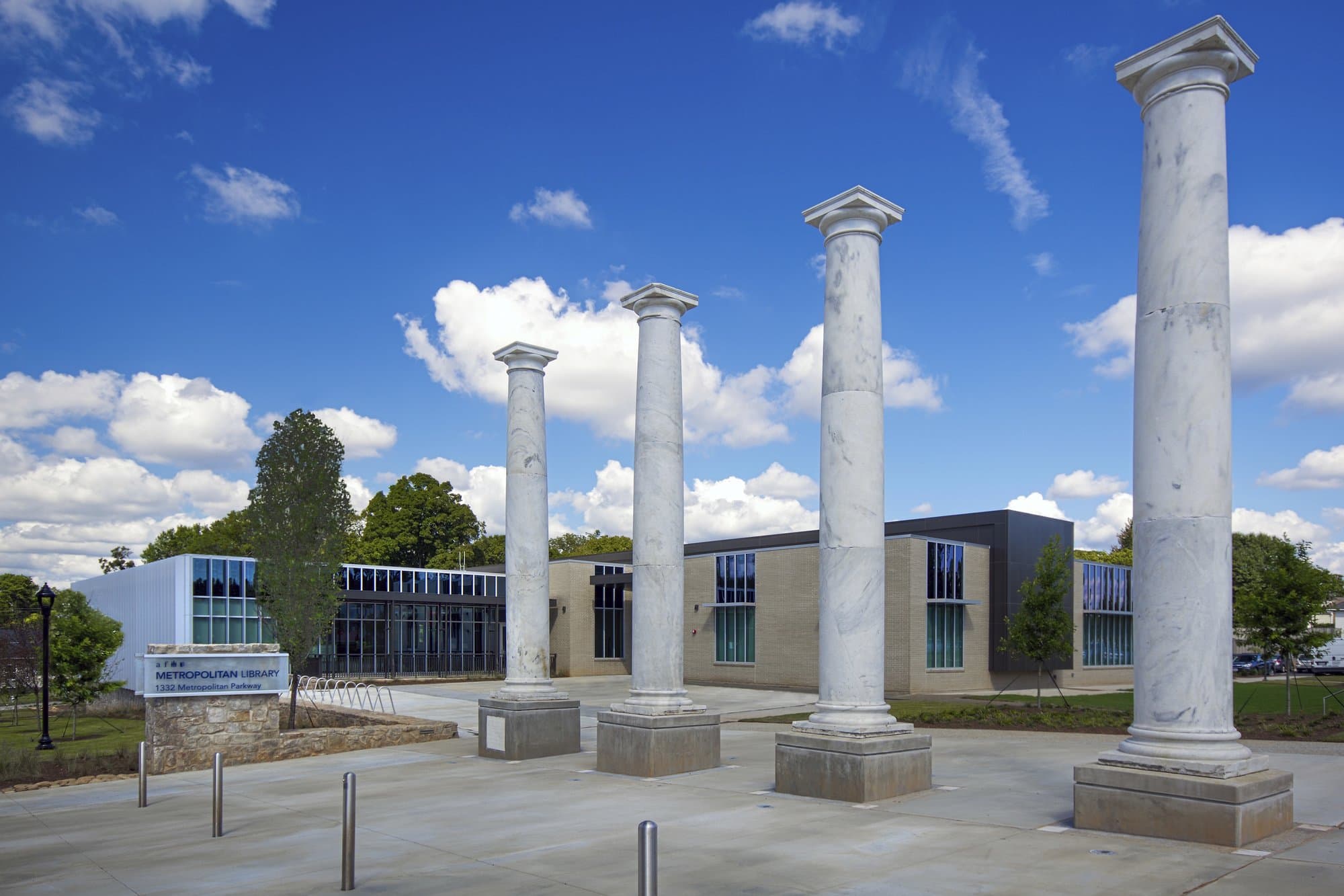Four white granite, Doric columns from a church that was previously in the location.