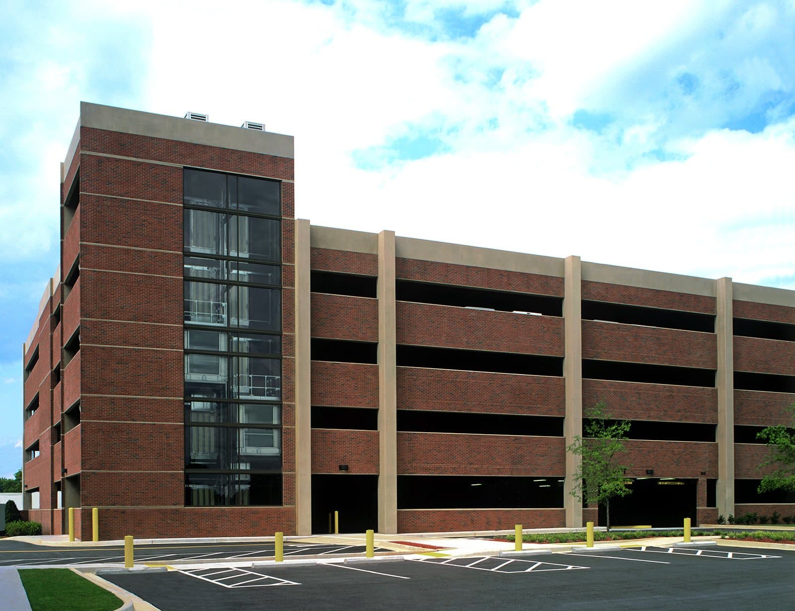 Side view of parking garage with elevators.