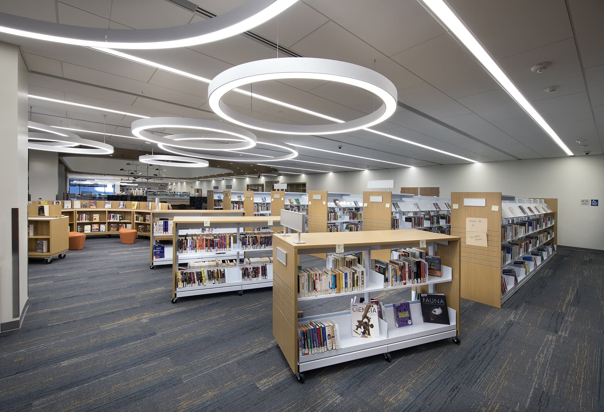 Books on shelves inside of a library.