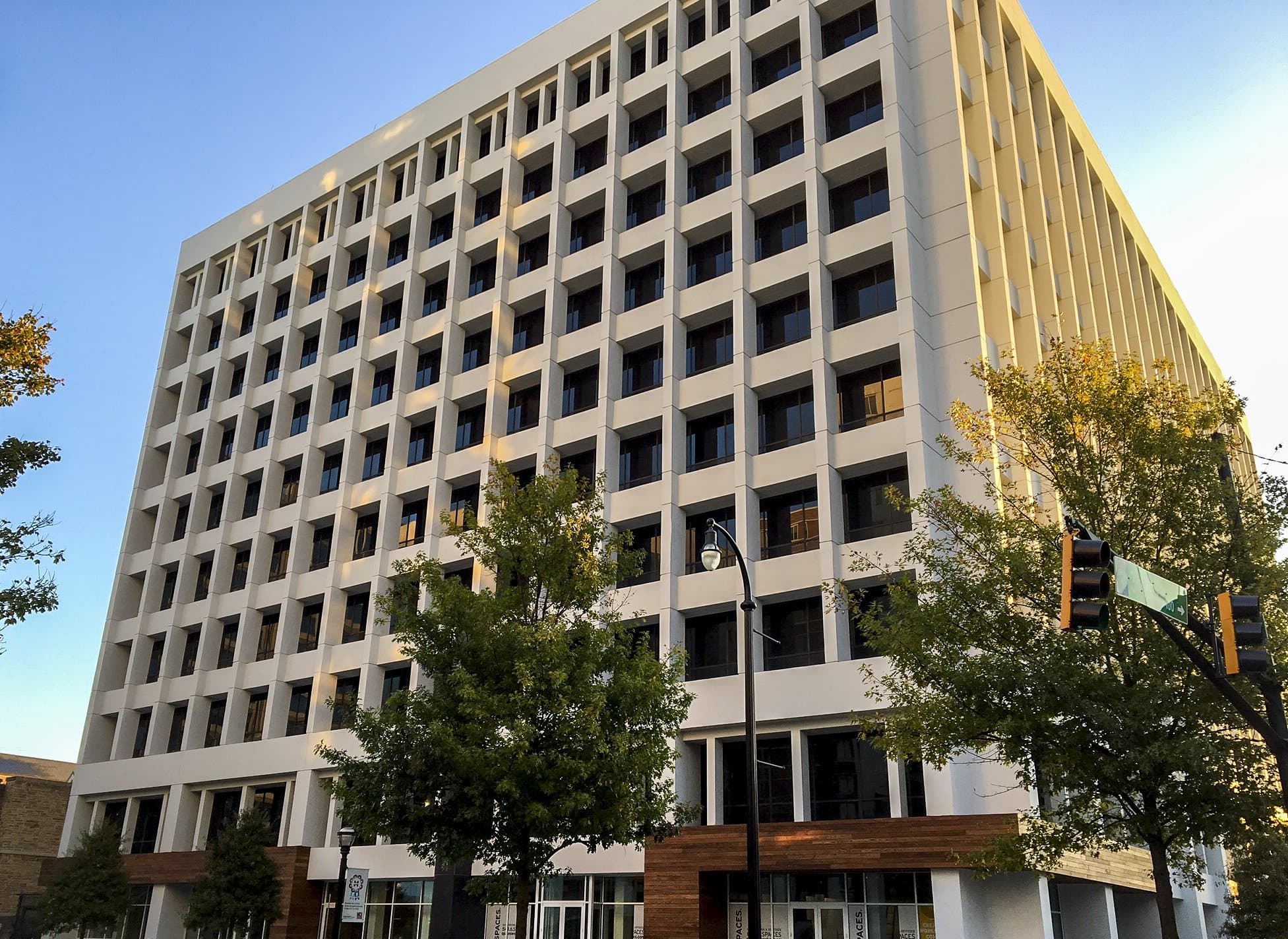 Outdoor picture of office building with windows.