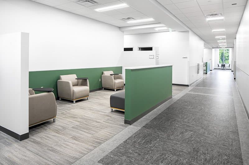 Seating area with armchairs and side tables.