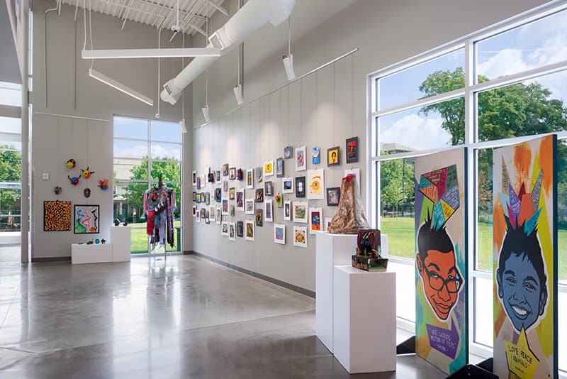 art gallery featuring paintings, masks, banners, and statues created by the Boys and Girls Club