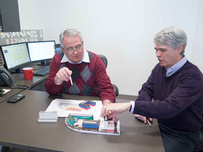 Alan Brossie and Winter CEO Brent Reid review at building model